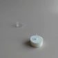 Shō-moon natural Tealights candle refill going in and out of tealight holder