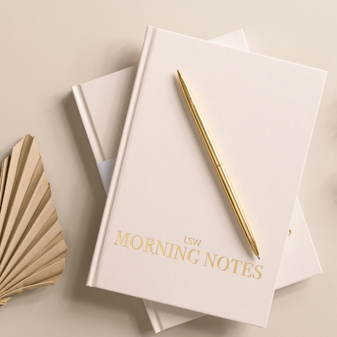 Morning Notes - Daily wellbeing journal LSW with a gold pen on top